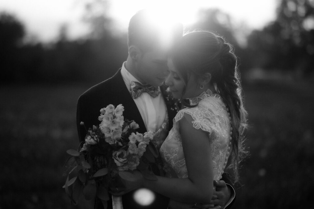Couple hugging at sunset during their Dolomites Elopement in Italy