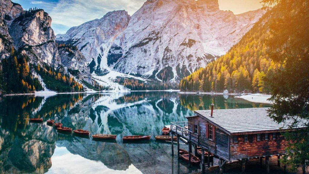 Landscape view of Briaies Lake with boats, iconic location for a Dolomites Elopement