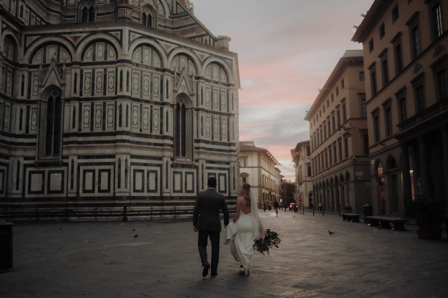 Bride and groom exploring Duomo di Firenze at sunrise during Italy Elopement